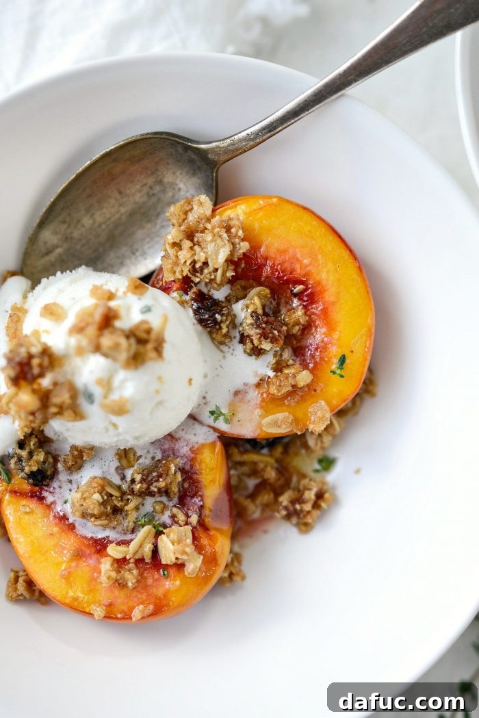 close up of Baked Nectarines with Oatmeal Cookie Crumble and vanilla ice cream 