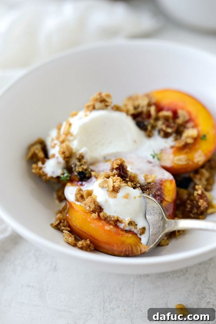 digging into Baked Nectarines with Oatmeal Cookie Crumble with a spoon