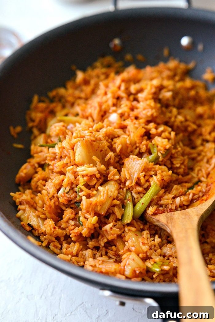 Ultimate Kimchi Fried Rice 16 A beautifully presented bowl of kimchi fried rice, waiting for its final garnishes.