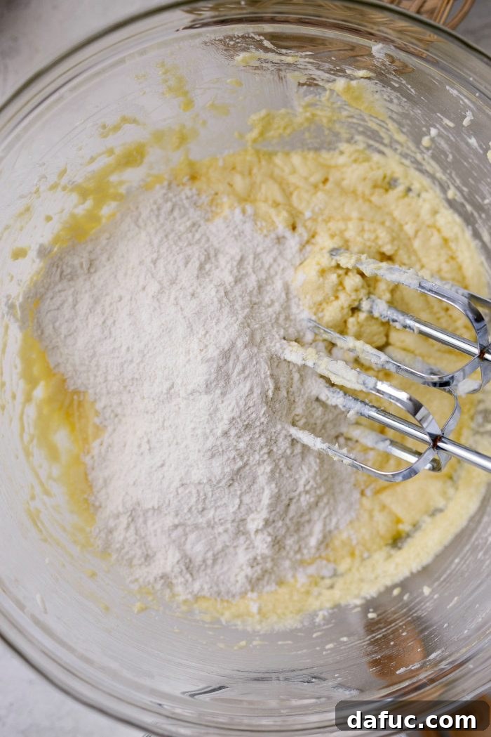 Cinnamon Apple Fritter Bread 11 Dry ingredients being added to the wet butter and sugar mixture