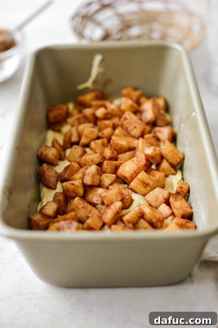 Cinnamon Apple Fritter Bread 15 Half of the diced apples distributed over the batter in the loaf pan