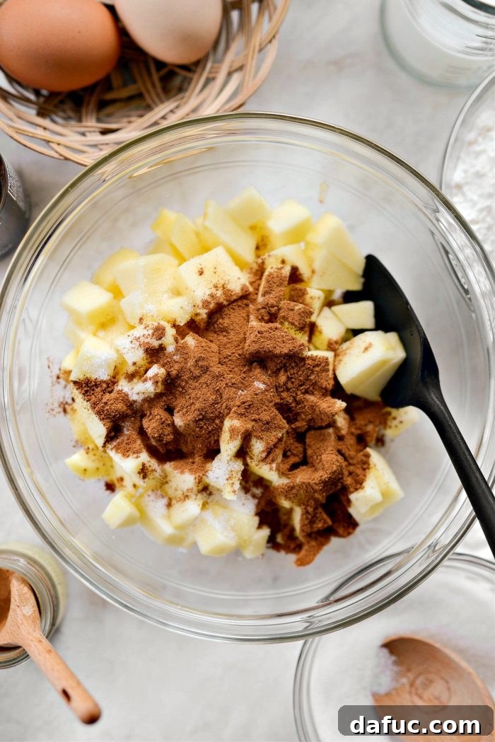 Cinnamon Apple Fritter Bread 6 Diced apples mixed with cinnamon and sugar in a bowl