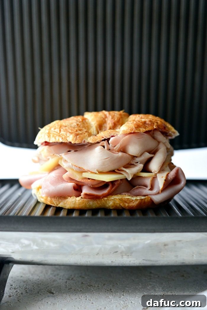 Monte Cristo Croissant Melt 12 Monte Cristo Croissant Panini on the panini press