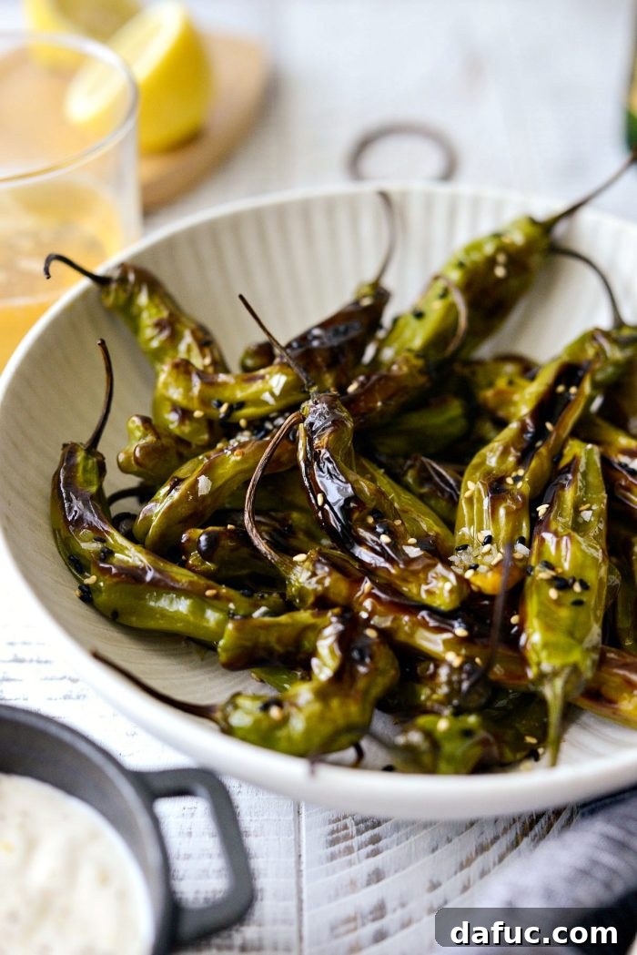 Sesame-Kissed Blistered Shishito Peppers with Zesty Lemon Garlic Aioli 3 A second appealing shot of blistered shishito peppers, highlighting their texture and vibrant green color