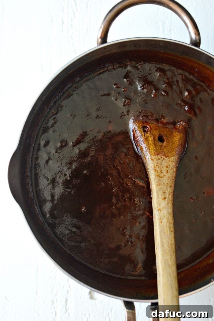 The thick and rich Coca-Cola Habanero BBQ Sauce in the pan after simmering, indicating it's ready for the next step.