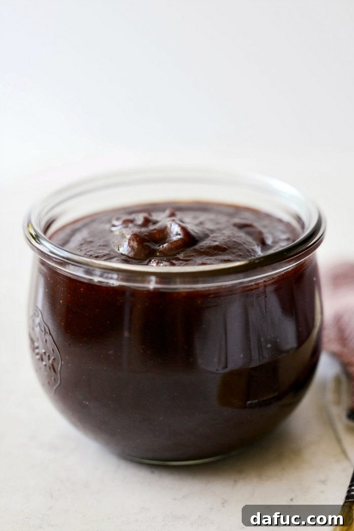 Smooth and pureed Coca-Cola Habanero BBQ Sauce in a glass jar, ready for storage.