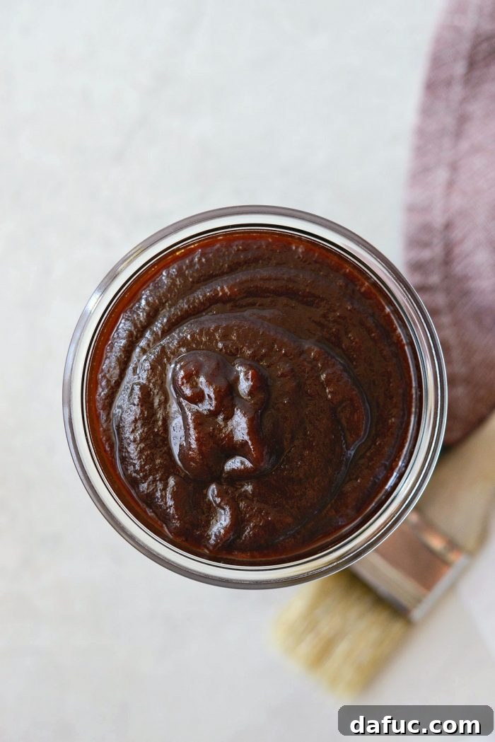 A serving of Coca-Cola Habanero BBQ Sauce in a small dish, highlighting its thick, sweet, and spicy qualities.