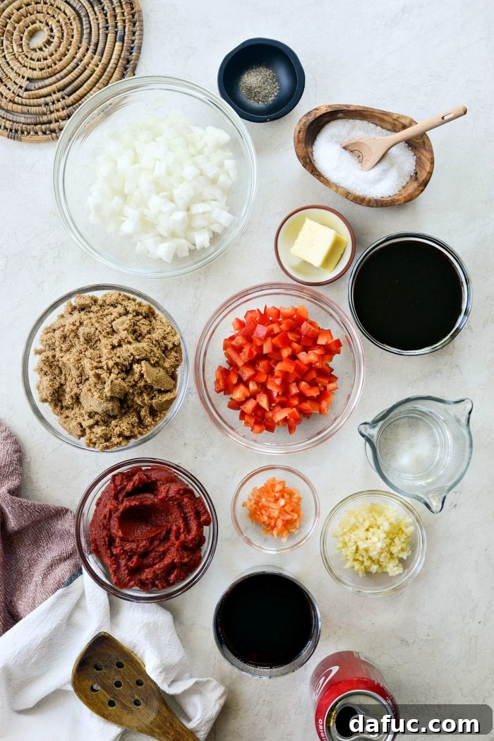 All the fresh ingredients for Coca Cola Habanero BBQ Sauce laid out on a cutting board, ready for preparation.