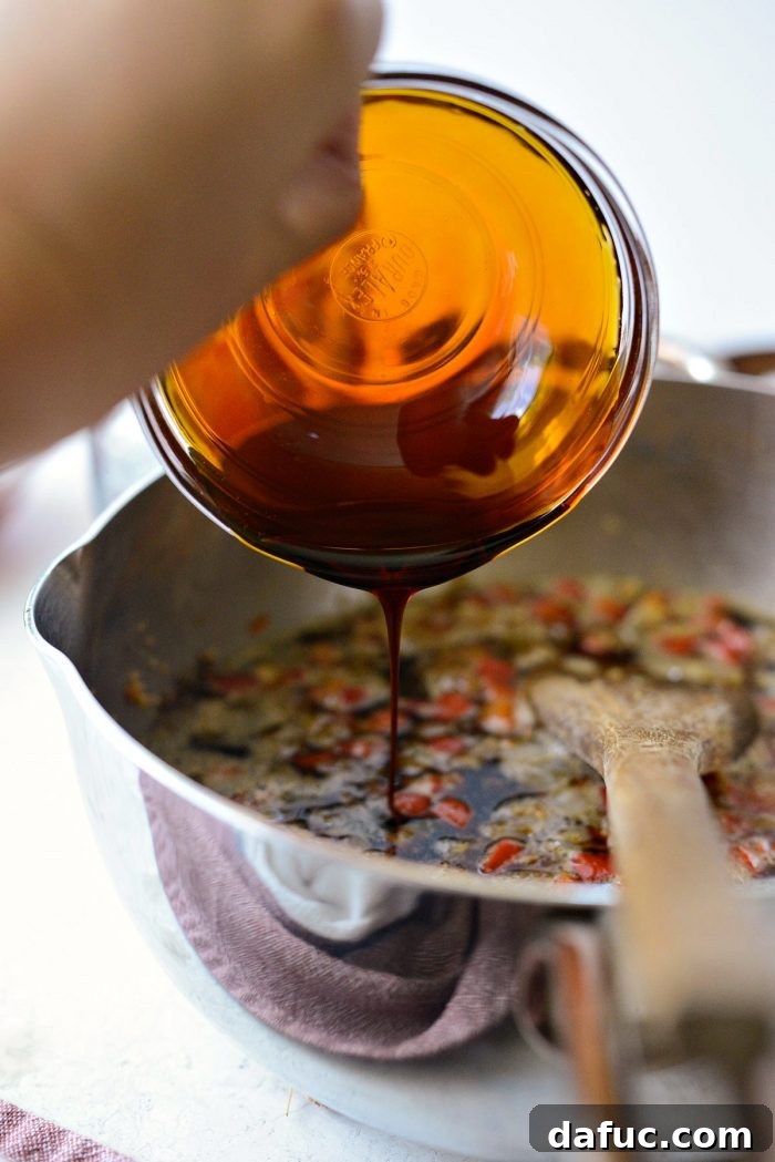 Un-sulphured molasses being poured into the sauce pan with other ingredients.