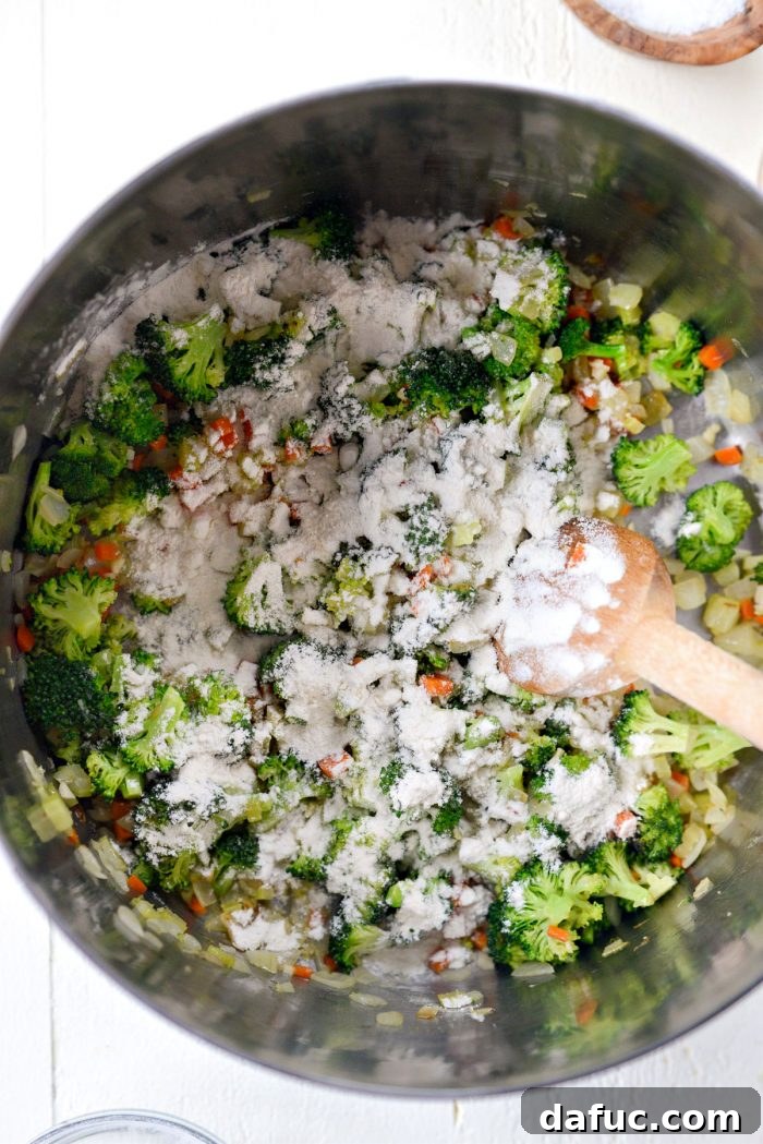 Hearty Ham, Swiss & Broccoli Delight 11 All-purpose flour sprinkled over softened vegetables in the pot, forming a roux for thickening.
