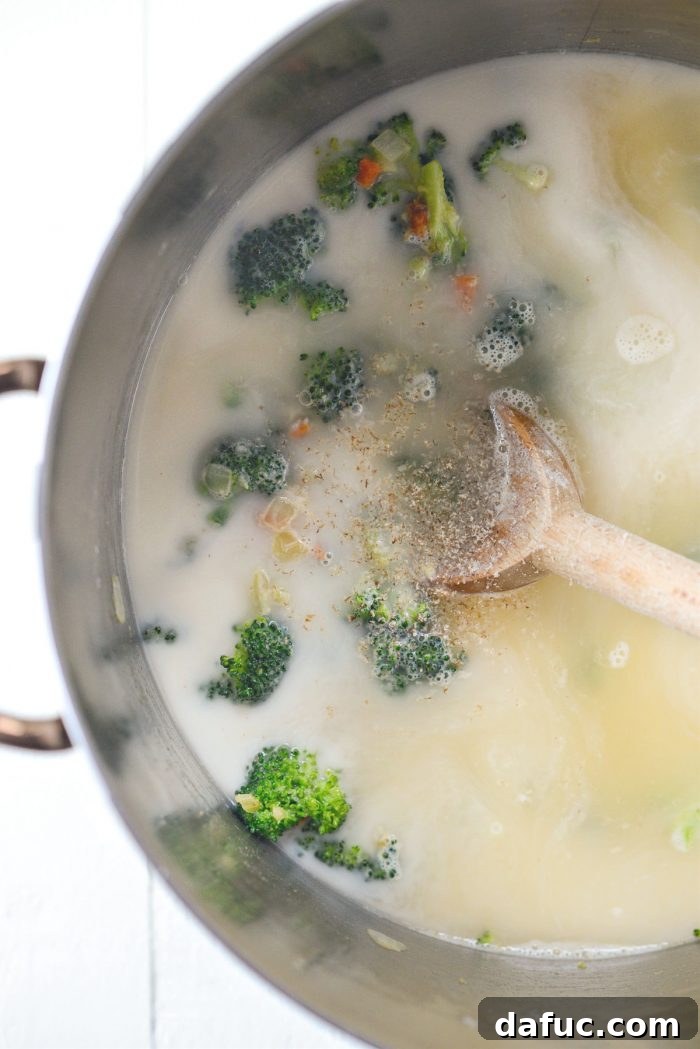 Hearty Ham, Swiss & Broccoli Delight 15 The soup gently simmering, thickening to a perfect creamy consistency.