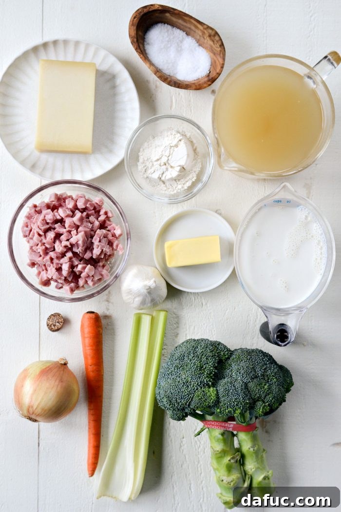 Hearty Ham, Swiss & Broccoli Delight 4 A vibrant display of fresh ingredients for Broccoli Ham and Swiss Soup, including broccoli, ham, Gruyere cheese, and aromatic vegetables.