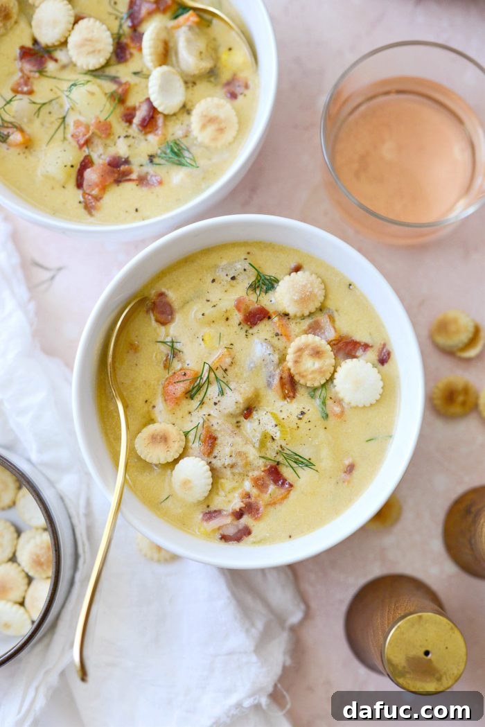 Coastal Catch Salmon Chowder 2 Homemade Salmon Chowder, showcasing a creamy texture and visible pieces of salmon, potatoes, and dill.