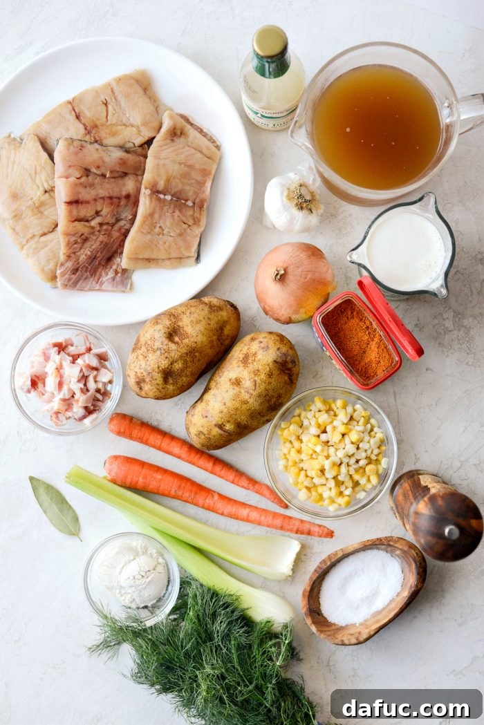 Coastal Catch Salmon Chowder 4 A collection of fresh ingredients laid out on a wooden board, including salmon fillets, potatoes, corn, carrots, celery, onion, garlic, half & half, dill, bacon, and various seasonings, ready for making salmon chowder.