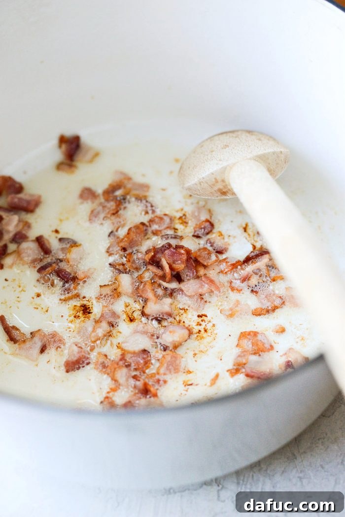 Seaside Salmon Chowder 6 Crispy bacon sizzling in a Dutch oven.