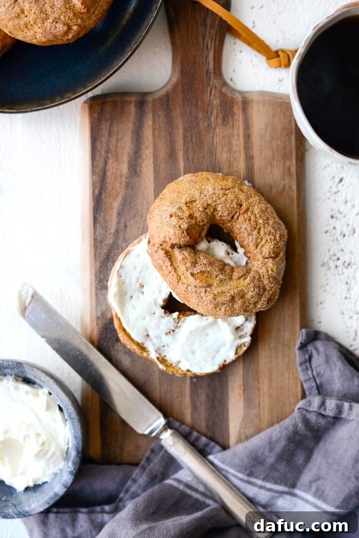 Delicious Air Fryer Pumpkin Spice Bagels 2 Freshly baked Air Fryer Pumpkin Spice Bagels with a sweet crackly topping.