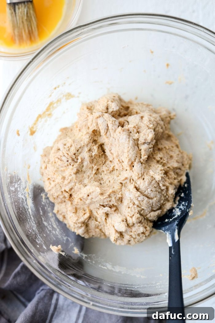 Delicious Air Fryer Pumpkin Spice Bagels 11 Bagel dough combined into a sticky ball with a spatula.