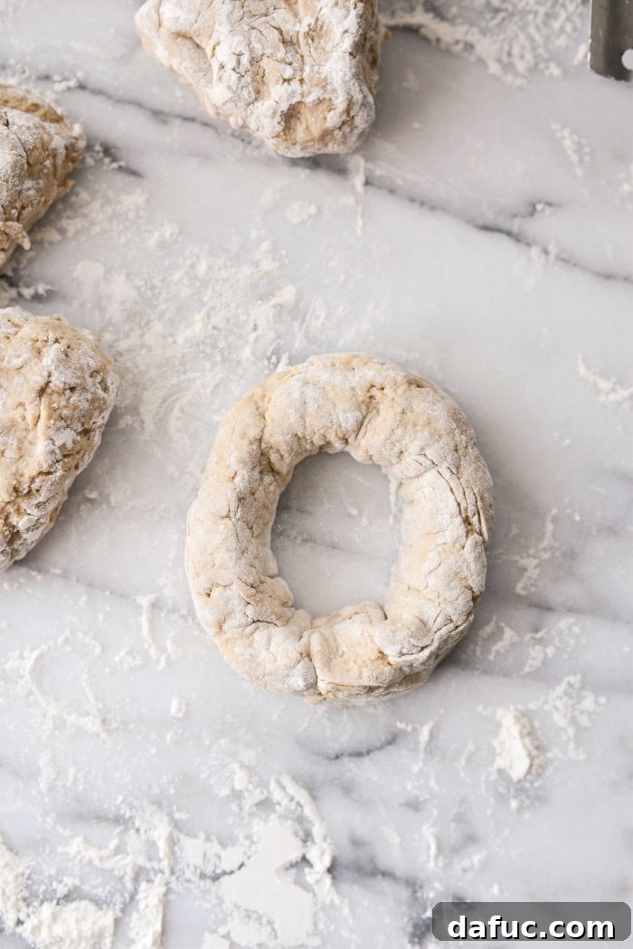 Delicious Air Fryer Pumpkin Spice Bagels 15 Connecting the ends of a dough rope to form a bagel shape.