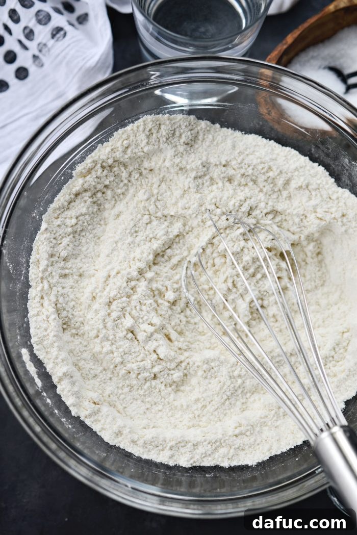 Dry ingredients for no-knead French bread in a bowl.