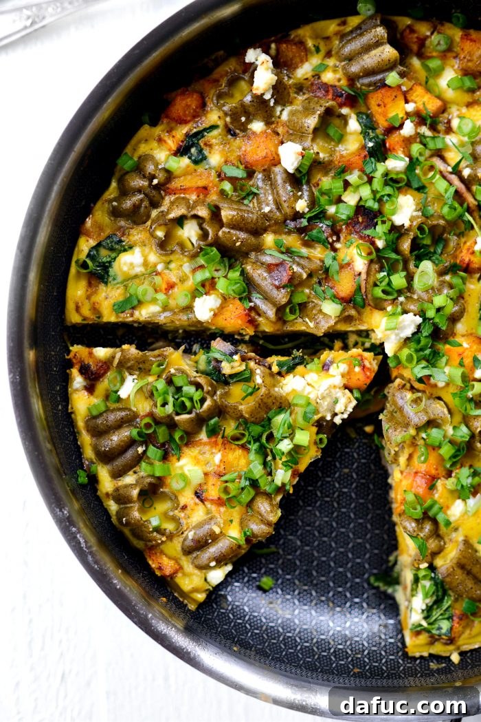 wedge of Roasted Pumpkin Kale and Feta Frittata.