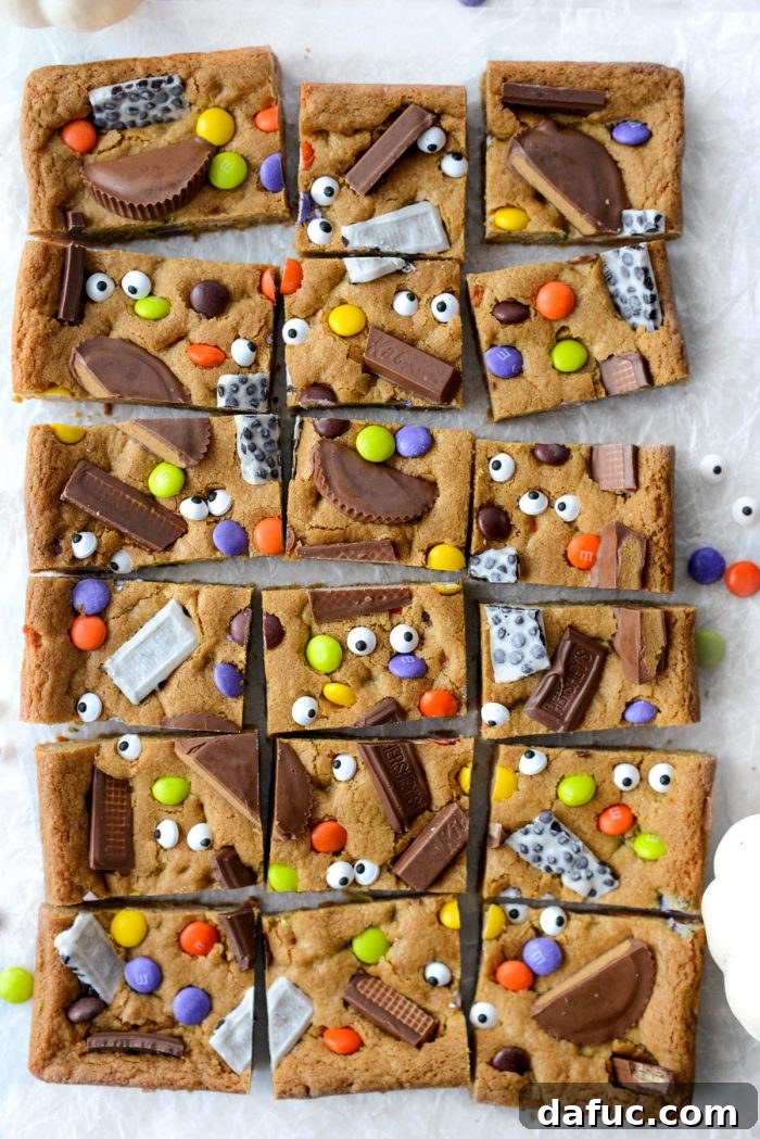 Halloween Haul Cookie Bars 20 A platter of Halloween Candy Cookie Bars, showcasing their delicious appearance and colorful toppings.