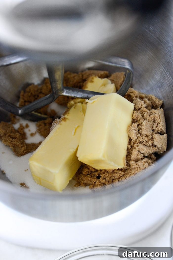 Halloween Haul Cookie Bars 6 Unsalted butter and both dark brown and granulated sugars in the bowl of a stand mixer, ready for creaming.