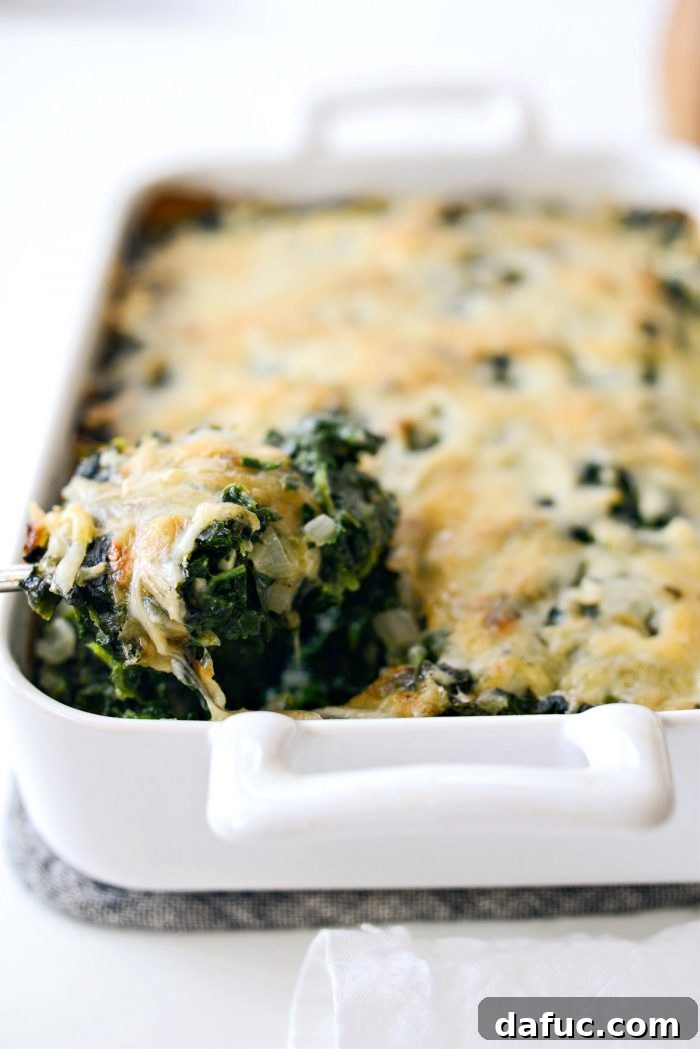 A close-up of the creamy, cheesy interior of Spinach Gratin, showing its inviting texture.