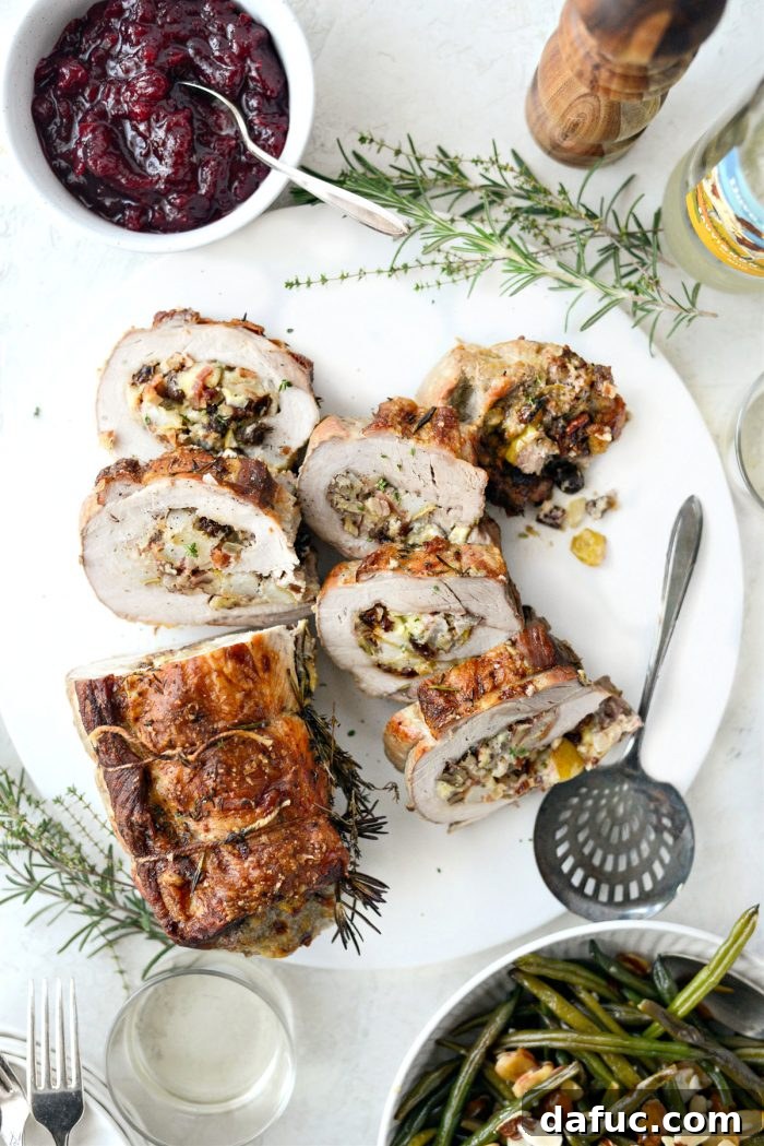 Sweet Pear, Savory Bacon, and Tangy Blue Cheese Stuffed Pork Loin 2 Bacon Pear and Blue Cheese Stuffed Pork Loin, a visually stunning roast with herbs