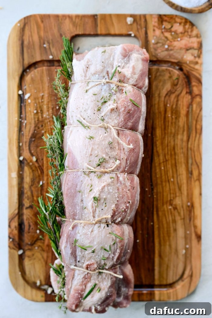 Sweet Pear, Savory Bacon, and Tangy Blue Cheese Stuffed Pork Loin 13 A perfectly rolled and tied pork loin, ready for roasting