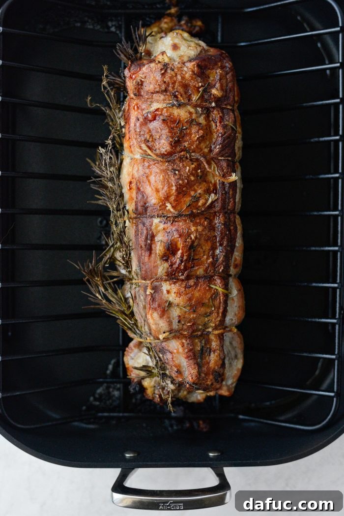 Sweet Pear, Savory Bacon, and Tangy Blue Cheese Stuffed Pork Loin 15 Roasted Bacon Pear and Blue Cheese Stuffed Pork Loin, golden brown and delicious