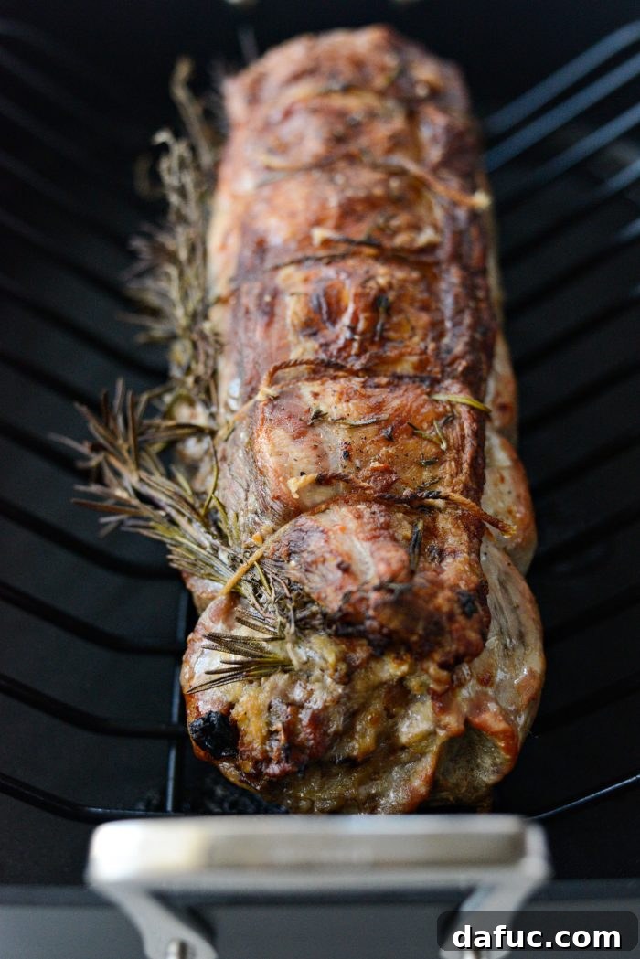 Sweet Pear, Savory Bacon, and Tangy Blue Cheese Stuffed Pork Loin 16 Close-up of the perfectly roasted Bacon Pear and Blue Cheese Stuffed Pork Loin
