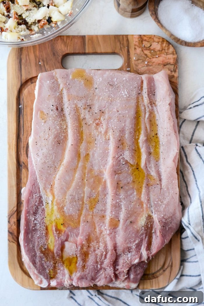 Butterflied pork loin seasoned with olive oil, salt, and pepper
