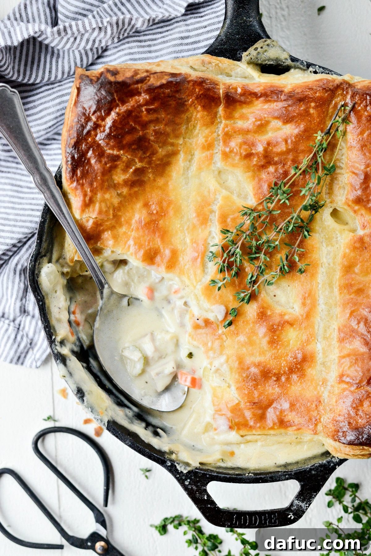 A perfectly golden-brown Skillet Turkey Pot Pie, crowned with flaky puff pastry and brimming with a rich, creamy filling of turkey, carrots, celery, and potatoes.