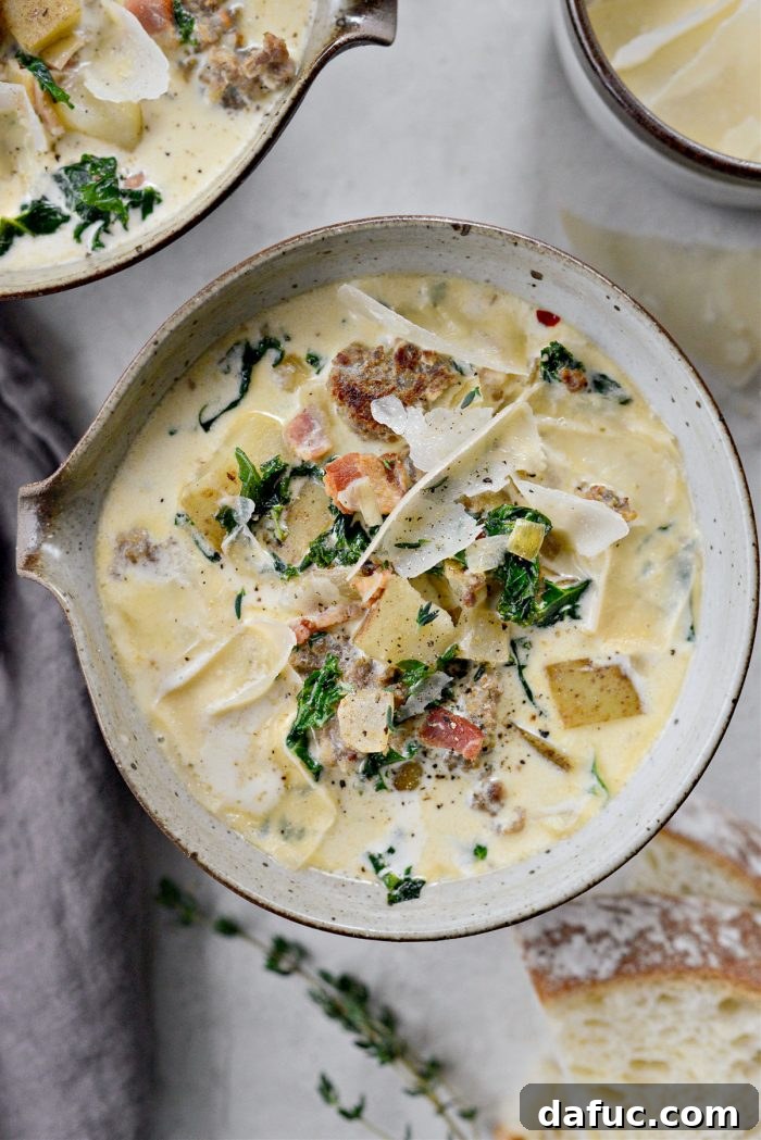 Classic Zuppa Toscana soup in a rustic bowl, served with crusty bread.