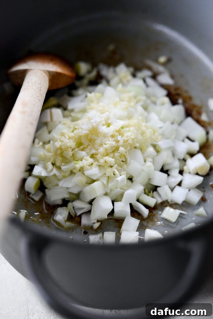 Diced onion and minced garlic sautéing in the Dutch oven.