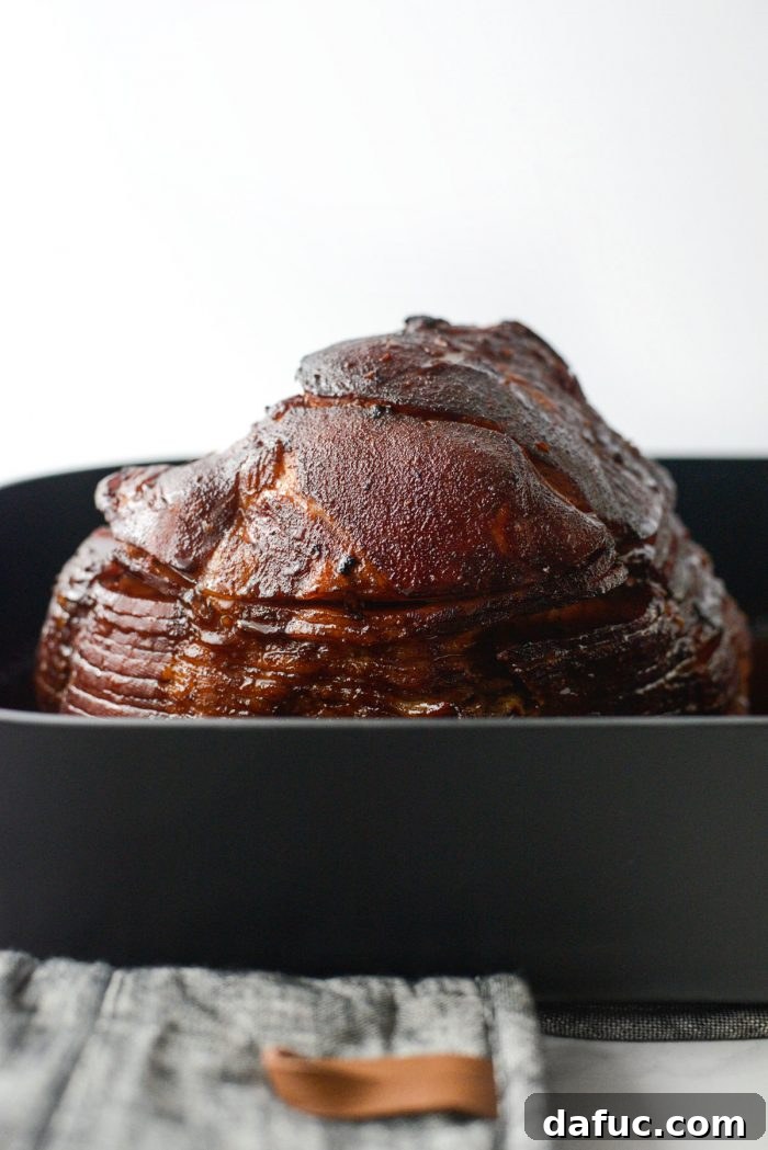 Jeweled Pomegranate Bourbon Glazed Ham 16 The Pomegranate Bourbon Glazed Ham, beautifully caramelized and sticky, after the second 15-minute glazing cycle in the oven.