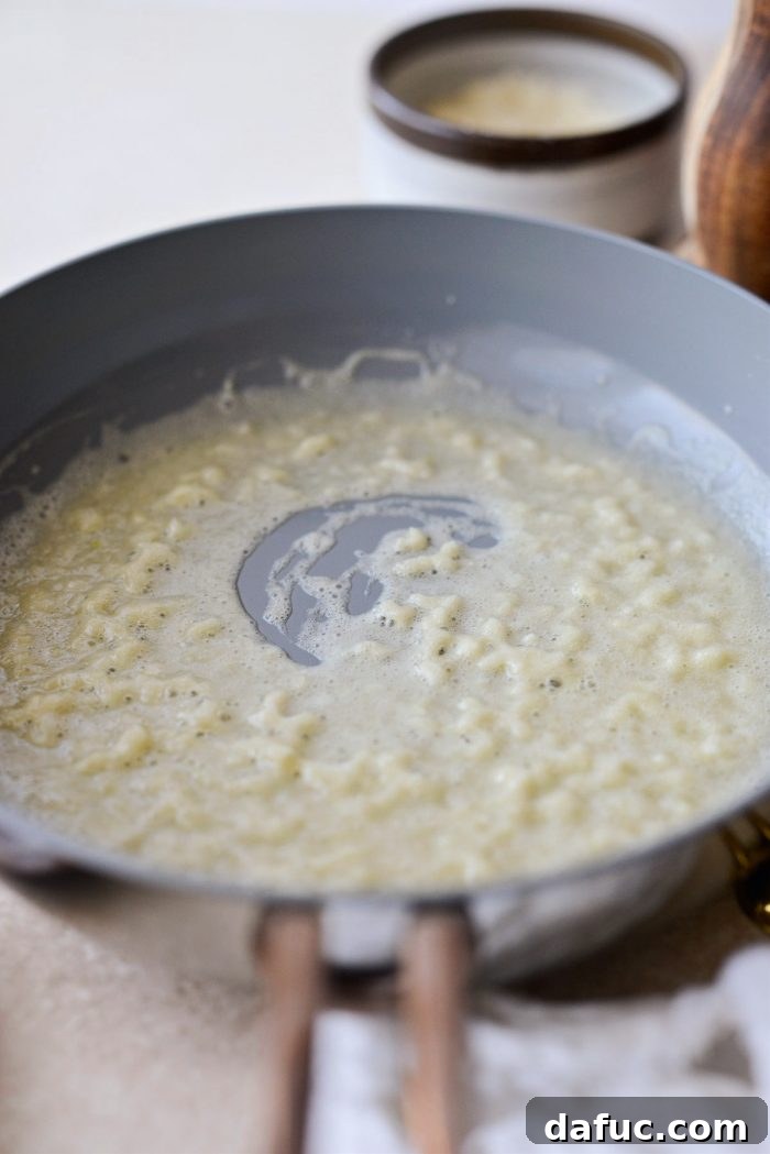 Golden Garlic Parmesan Corn Gratin 13 Smooth roux mixture in a small skillet