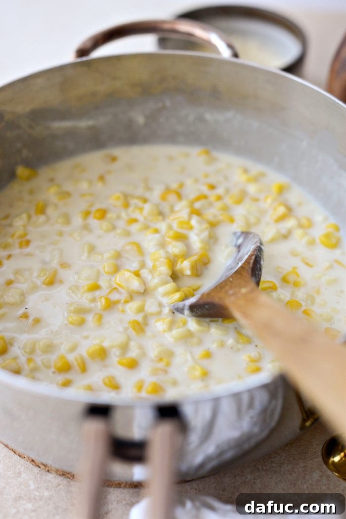 Golden Garlic Parmesan Corn Gratin 15 Stirring to thicken the Parmesan Garlic Corn Au Gratin mixture