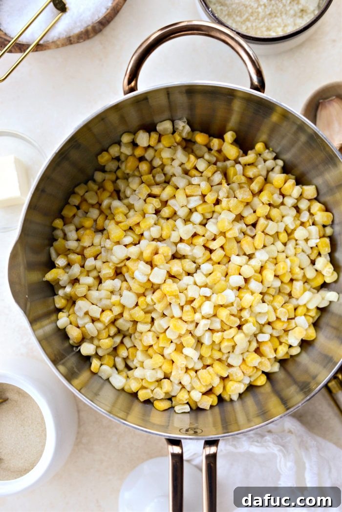 Golden Garlic Parmesan Corn Gratin 5 Frozen sweet corn added to a saucepan