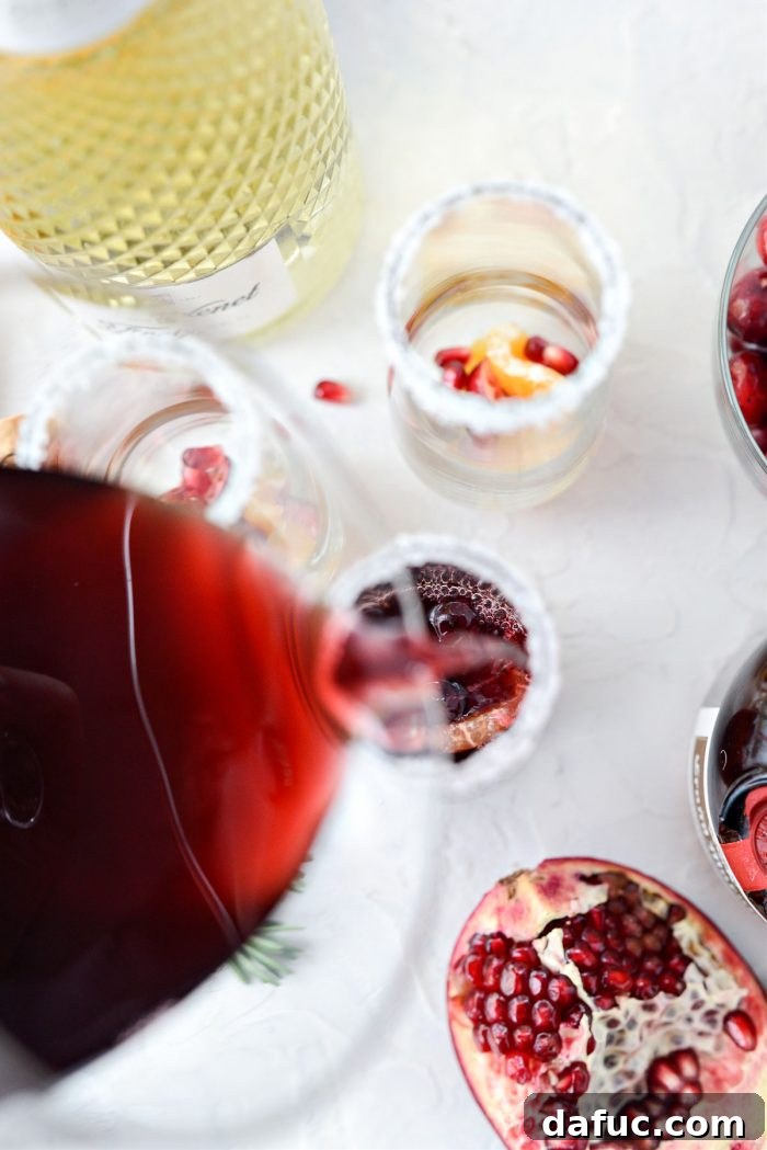 Bright & Bubbly Christmas Mornings 12 Pouring the mixed cranberry and pomegranate juice into a garnished champagne glass
