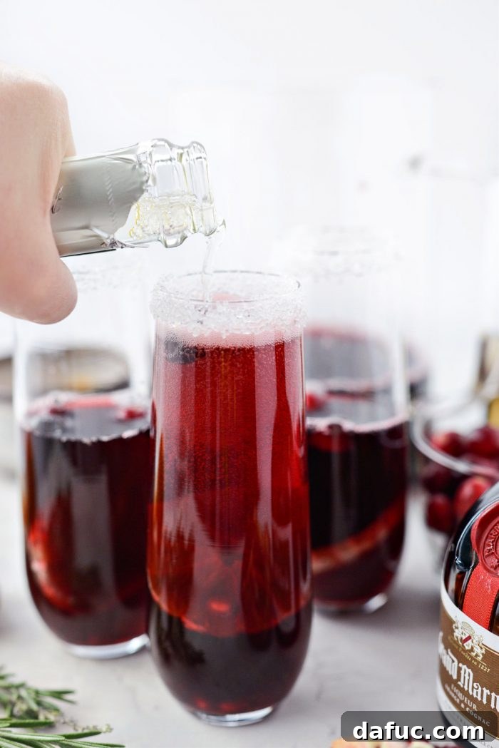 Bright & Bubbly Christmas Mornings 14 Topping off the mimosa glasses with chilled Prosecco