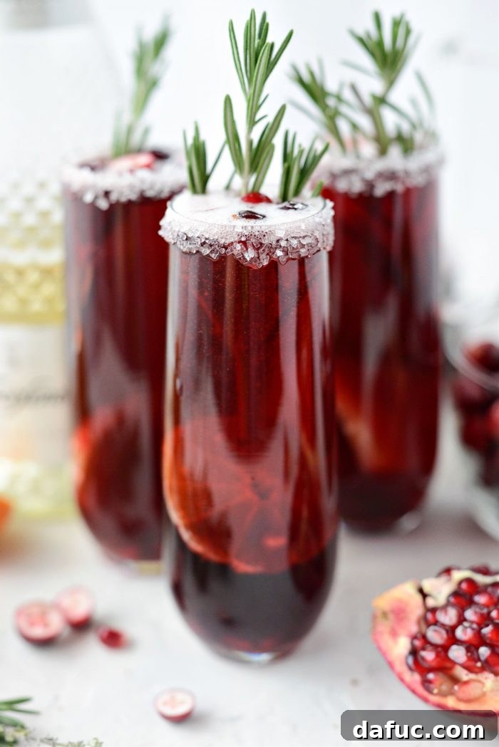 Bright & Bubbly Christmas Mornings 15 Garnishing Christmas Morning Mimosas with a fresh rosemary sprig