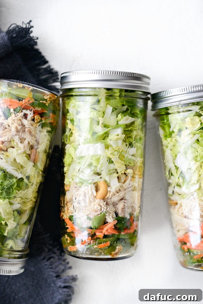 A completed Asian Cashew Chicken Mason Jar Salad, ready for refrigeration.