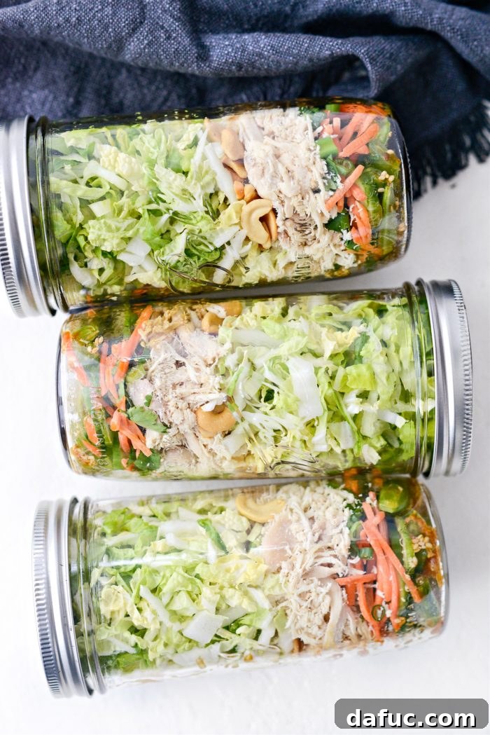 A selection of prepped Asian Cashew Chicken Mason Jar Salads, ready for the week.