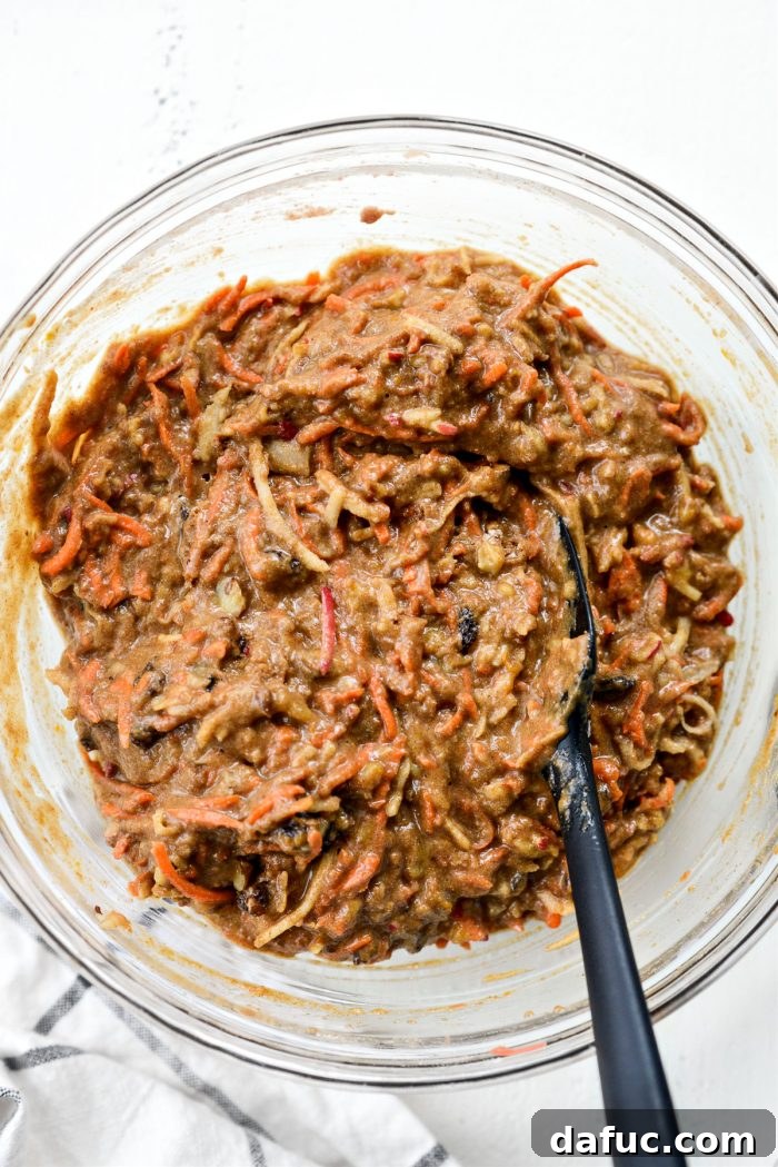 Fully combined Morning Glory Muffin batter in a large bowl, ready for scooping.