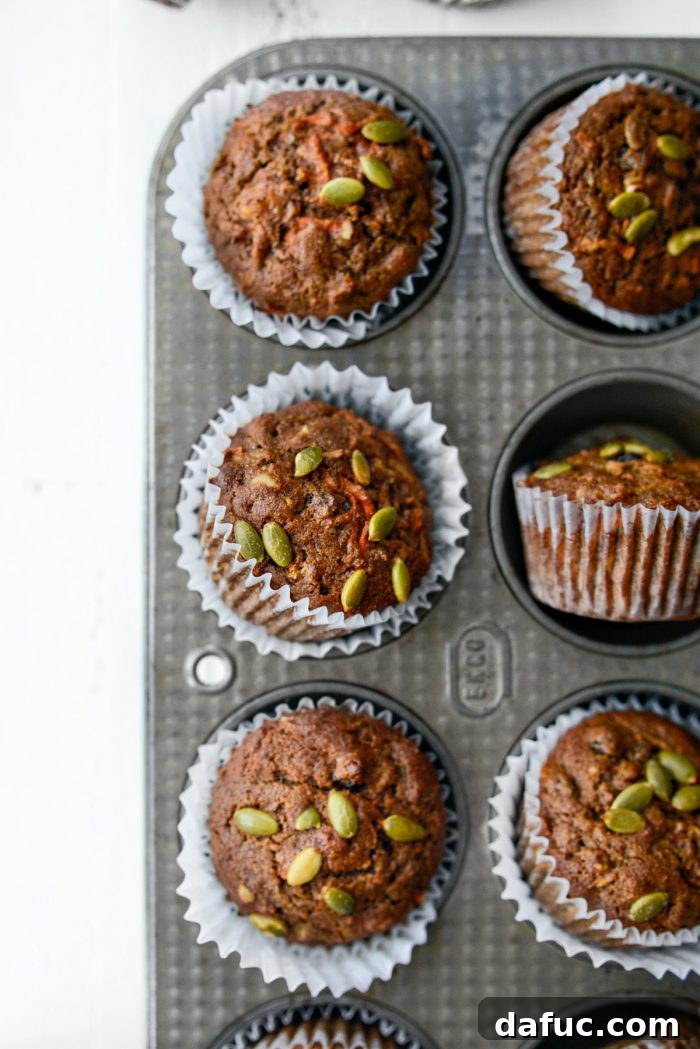 Delicious Morning Glory Muffins arranged on a cooling rack.