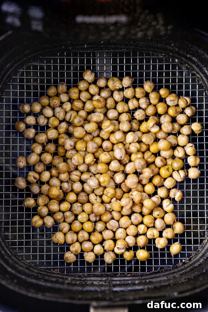 Perfectly Crisp Air-Fried Chickpeas 11 Air frying chickpeas in the basket until they are golden brown and crispy