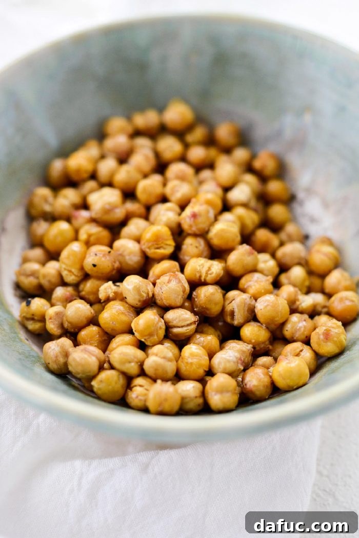 Perfectly Crisp Air-Fried Chickpeas 3 A close-up of crispy air fryer chickpeas being served, highlighting their golden texture