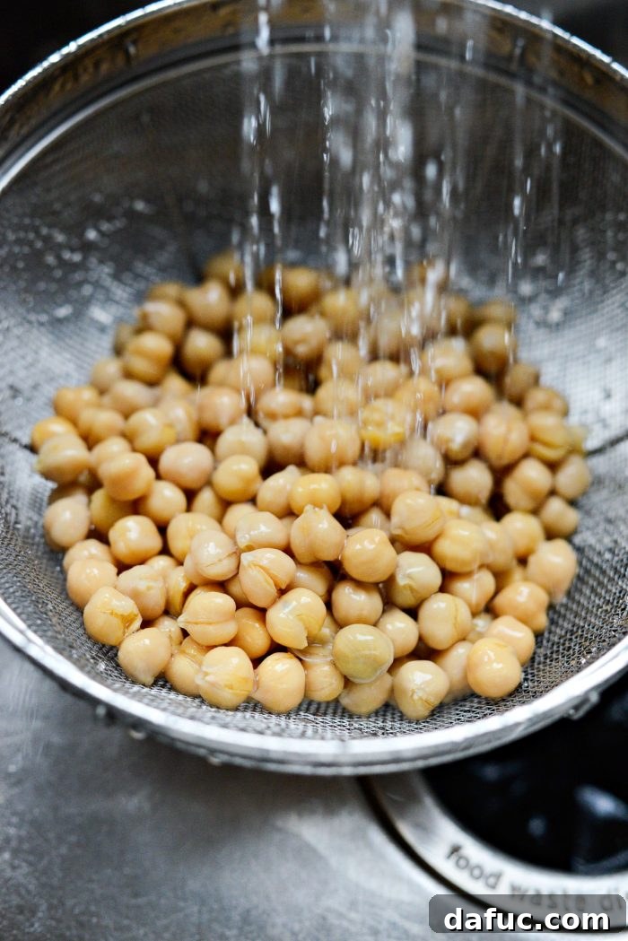 Perfectly Crisp Air-Fried Chickpeas 5 Draining and rinsing canned chickpeas in a colander under running water