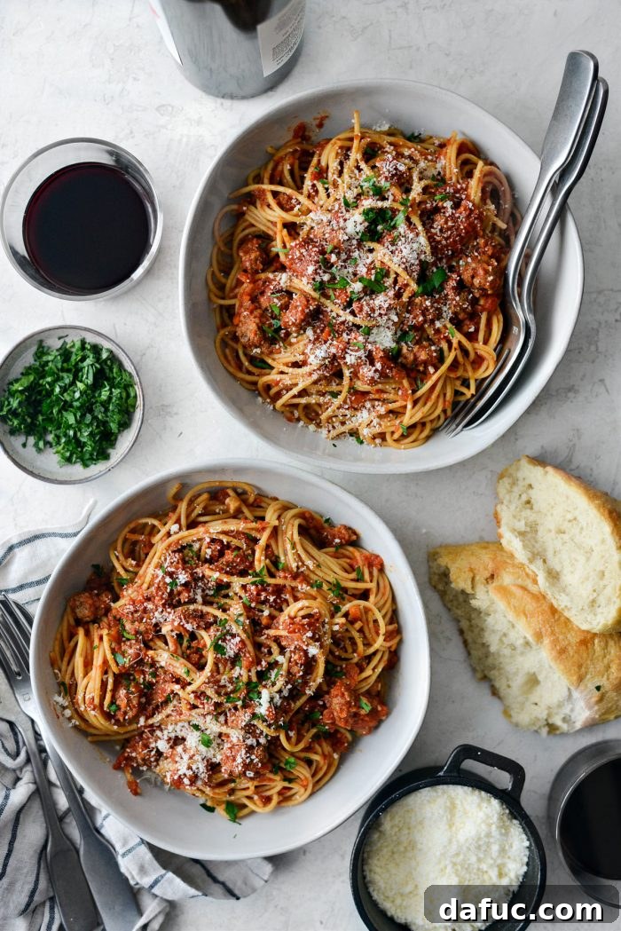 Slow Roasted Spaghetti Sauce 19 Plated slow baked spaghetti sauce with fresh parmesan and parsley, ready to eat.